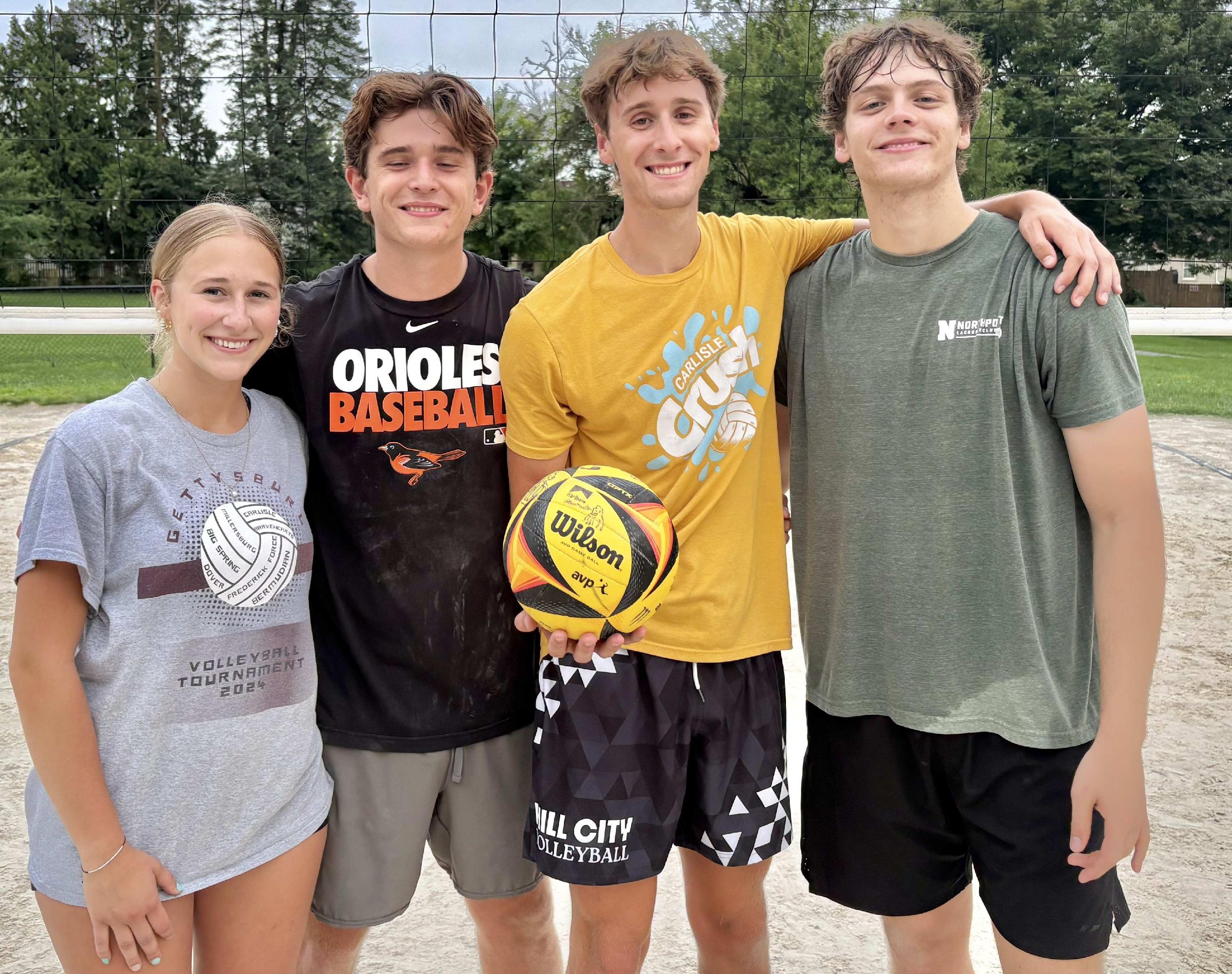People holding a volleyball